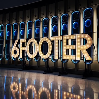 Illuminated '6FOOTER' marquee sign at the TALL Excellence Gala