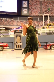 Attendee in green dress on the gala floor