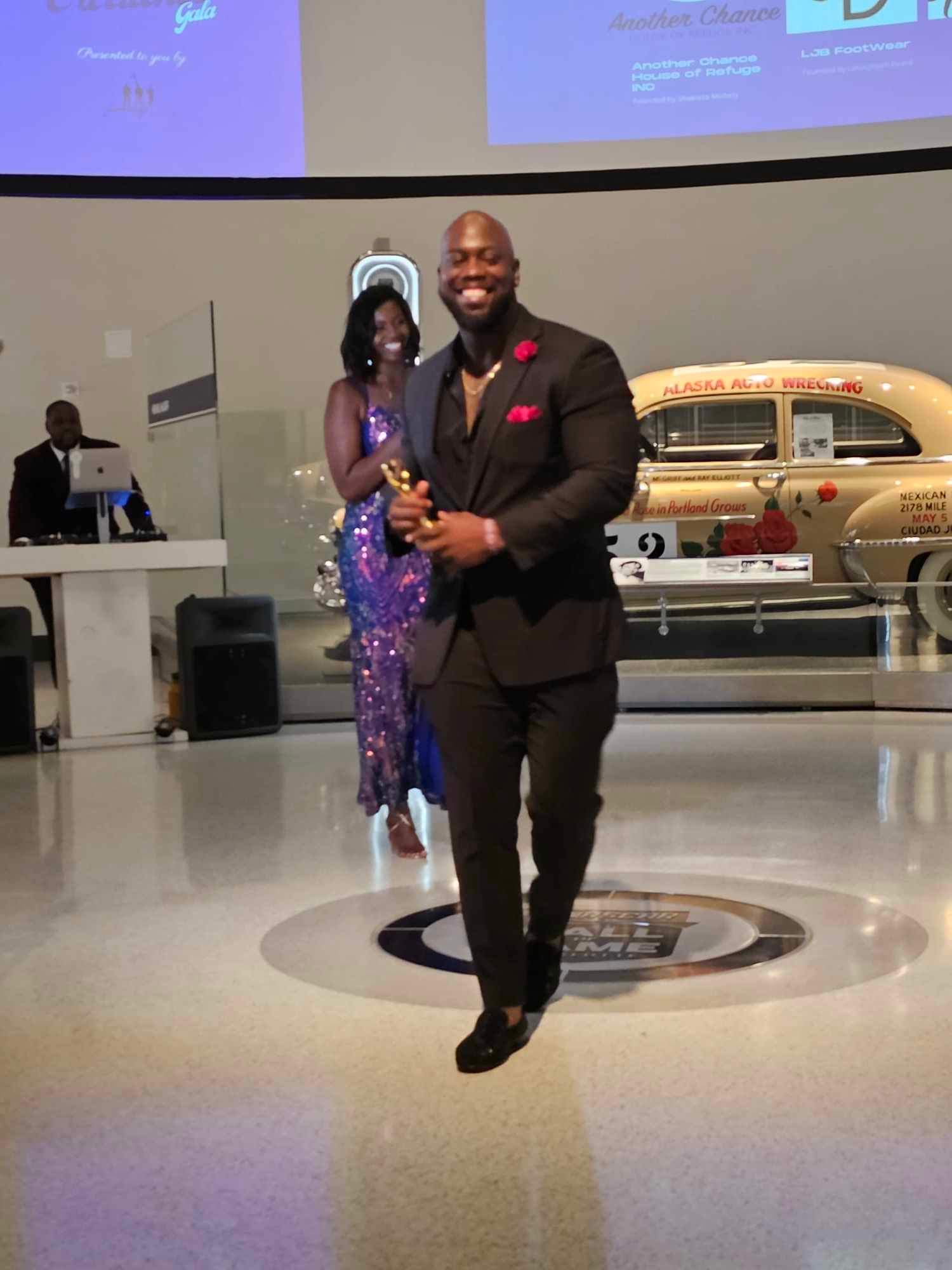 Honoree receiving award at the 6-Footers Gala